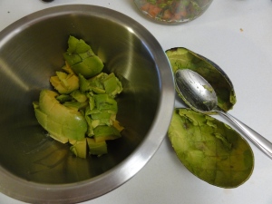 Avocado spooned into a bowl